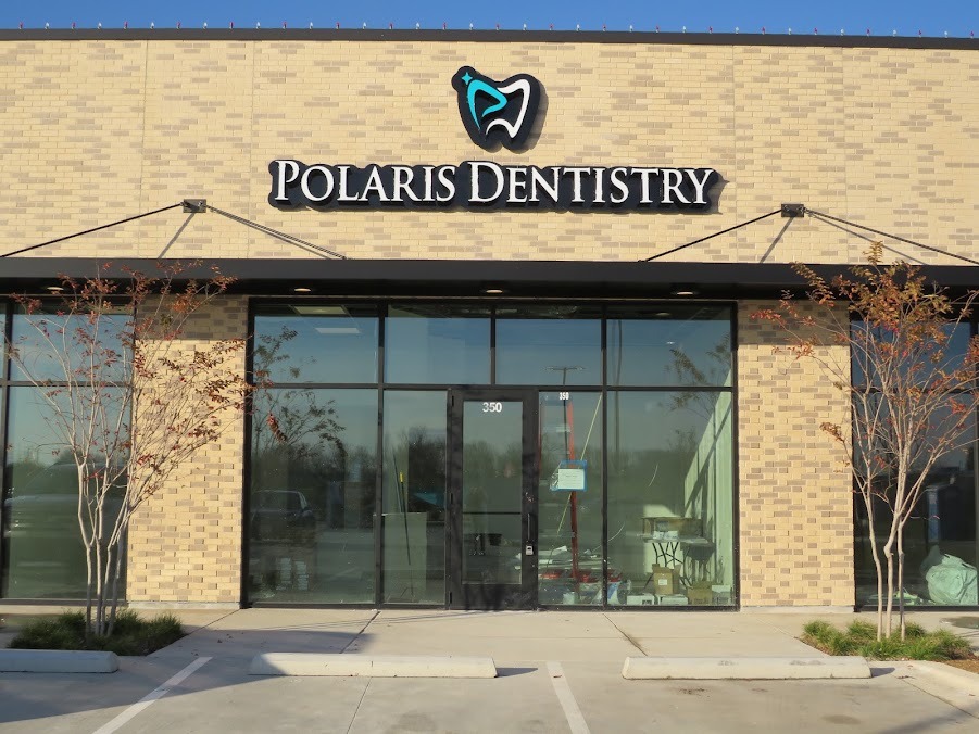 Polaris Dentistry storefront with the practice sign above the glass entrance