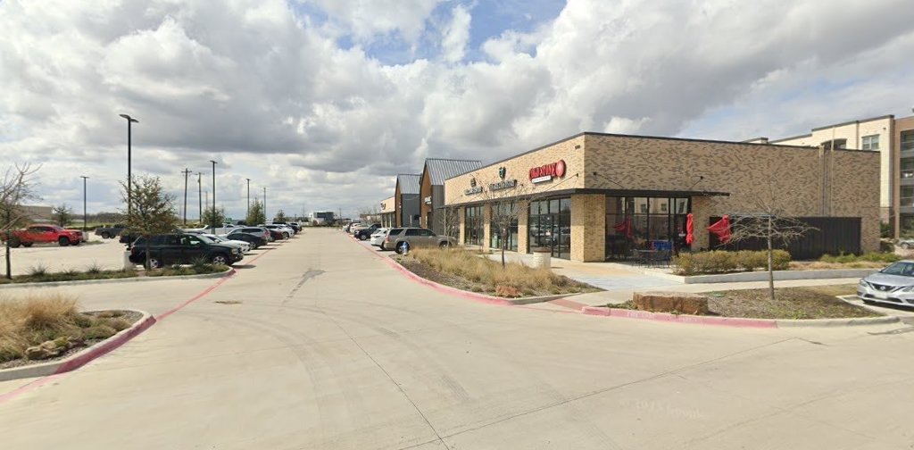 Shops and parking along the drive at The Station Sachse